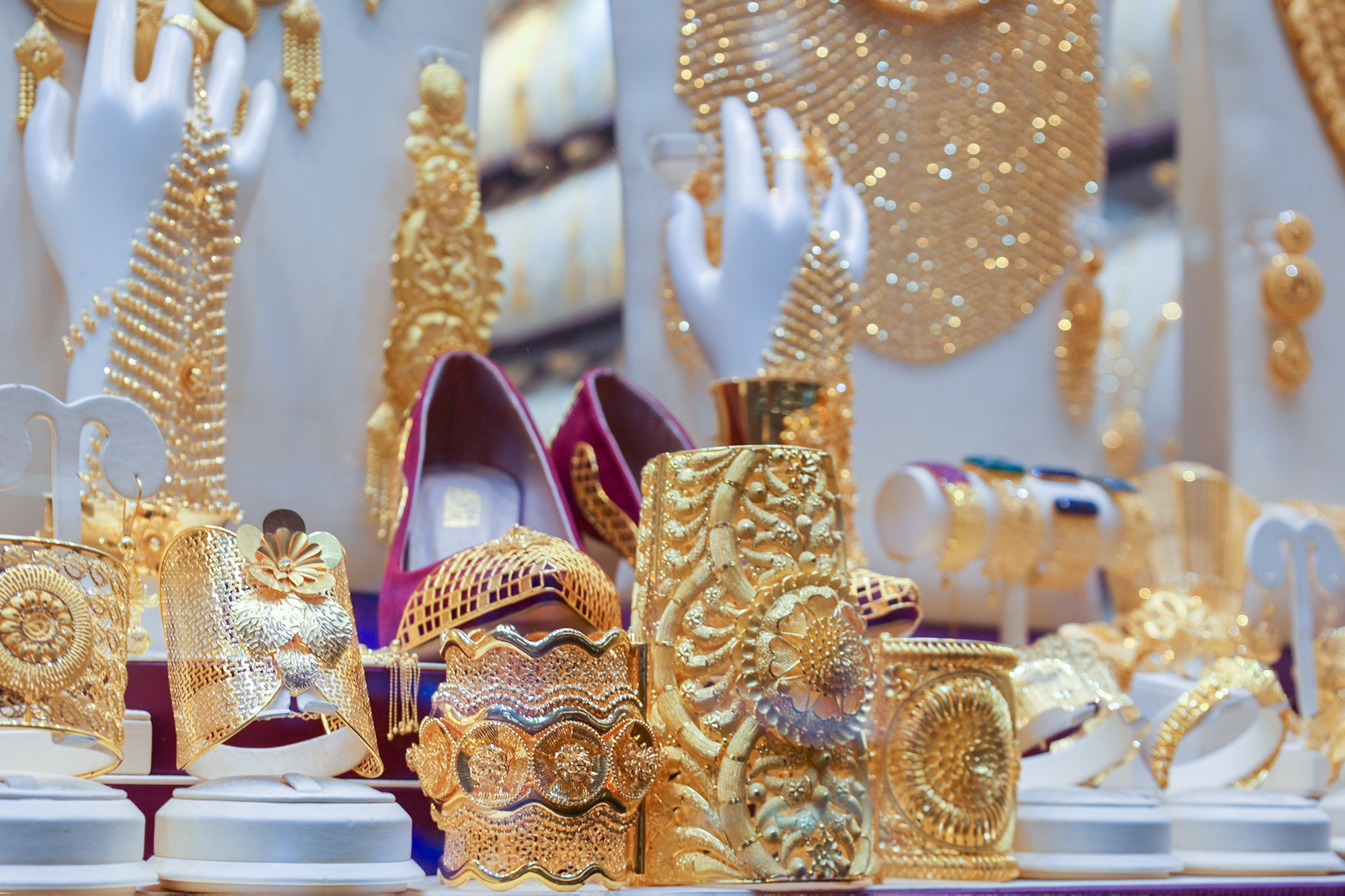 Elegant shiny jewelry in shop window. Gold market in old town of Dubai. Jewelry Bazaar. Gold Souk in