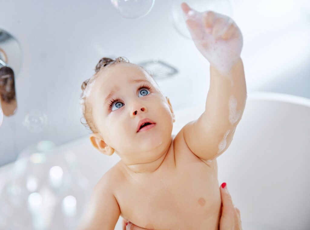 Shot of an adorable baby boy taking a bath at home