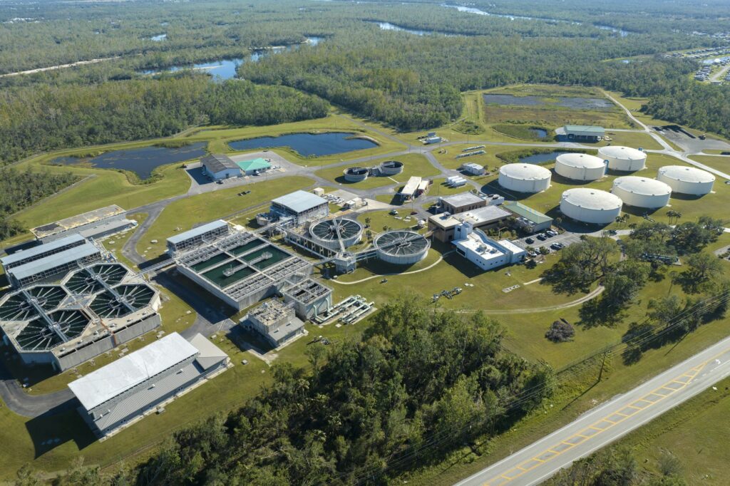 Aerial view of water treatment factory at city wastewater cleaning facility.