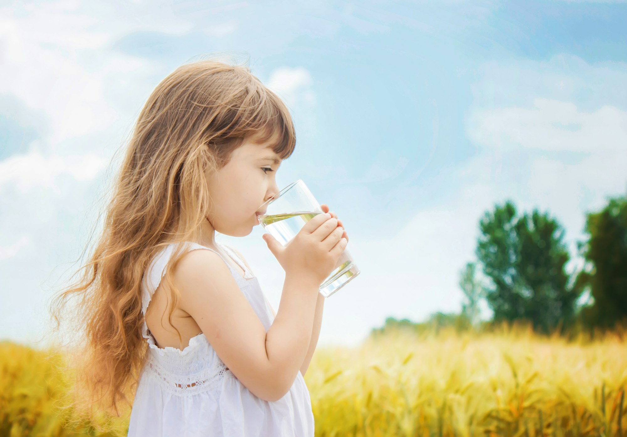 Child drinks water. selective focus, drink.