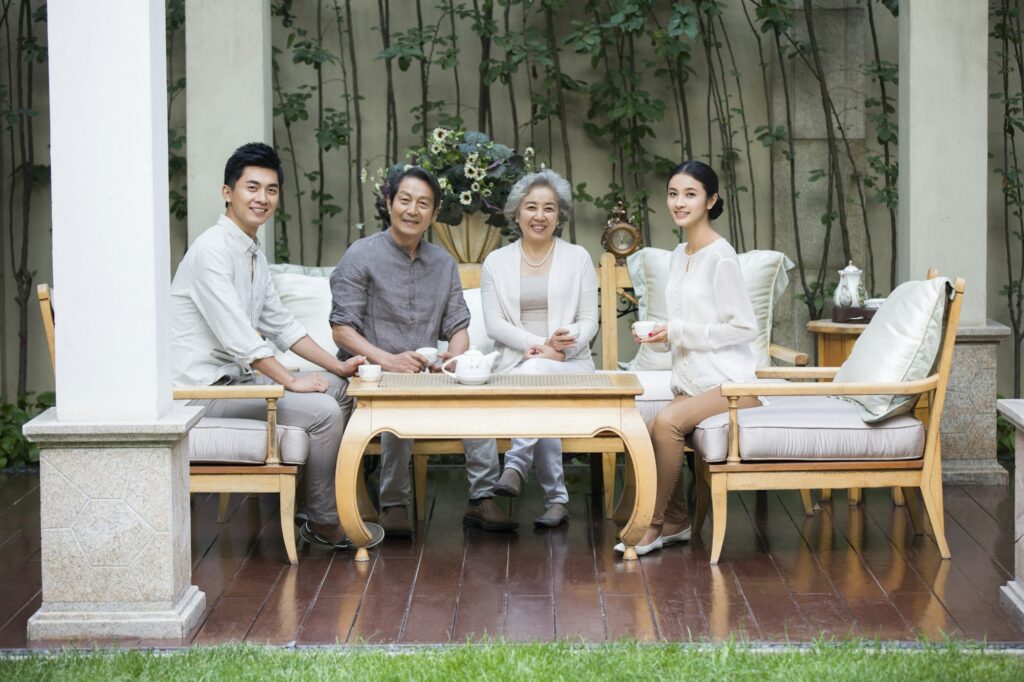 Happy family drinking tea together