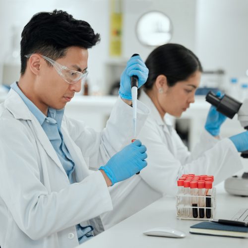 Time to send this off to the lab. Shot of a young man filling a test tube in a lab. Time to send this off to the lab. Shot of a young man filling a test tube in a lab.